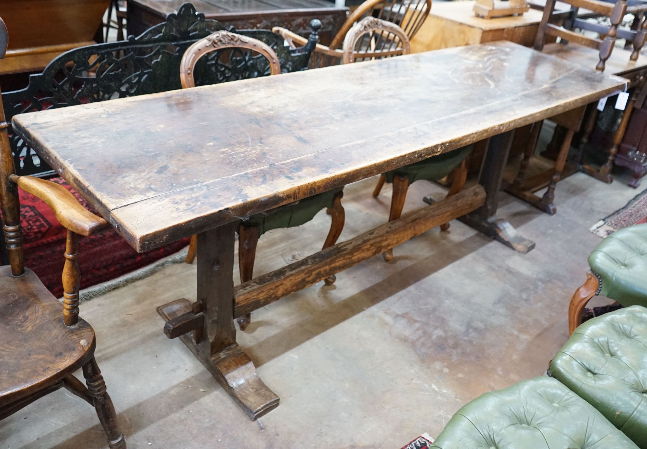 A rectangular oak refectory dining table, length 228cm, depth 64cm, height 78cm